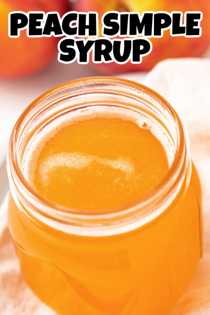 Close up view of a jar of peach flavored simple syrup.