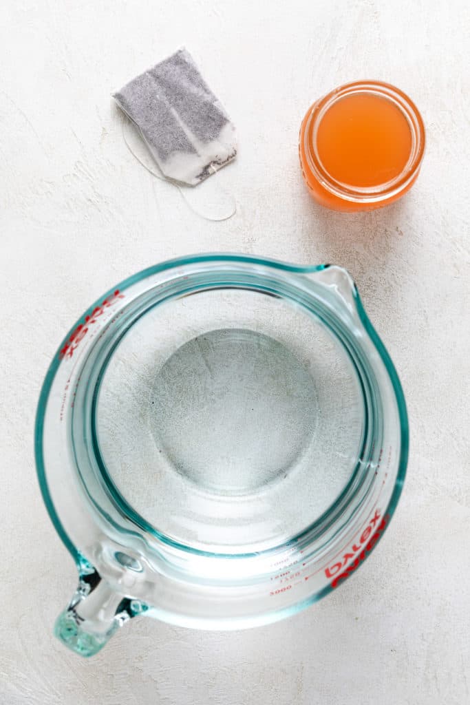 Water, tea bag, and peach simple syrup needed for peach iced tea.