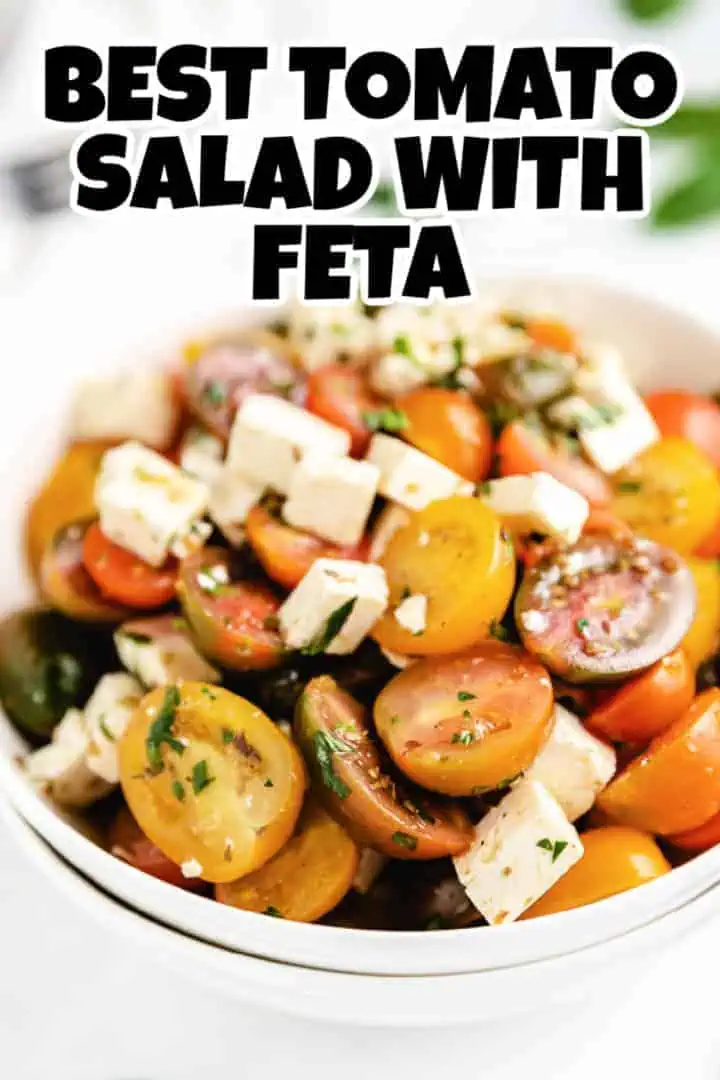 Close up view of tomato salad in a stack of white bowls.