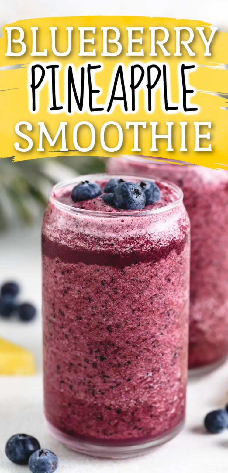 Fruit smoothie topped with blueberries.