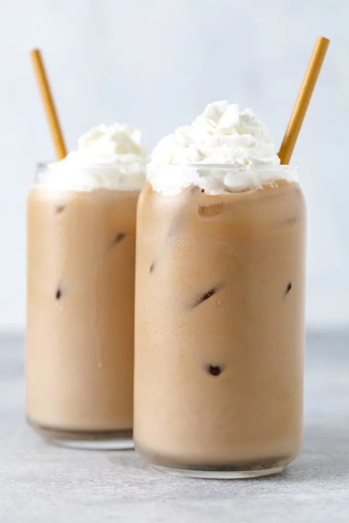 Two iced blonde vanilla lattes in can glasses.