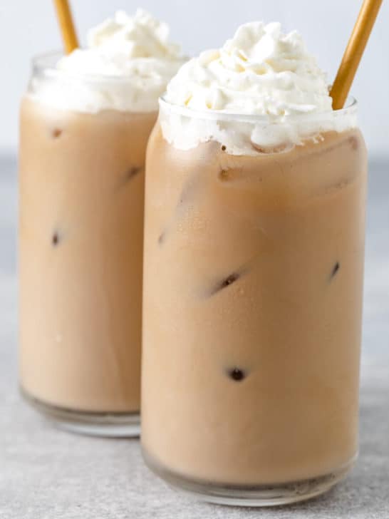 Close up view of two iced blonde vanilla latte drinks.