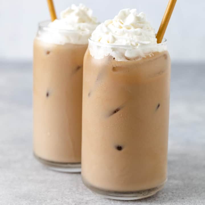 Close up view of two iced blonde vanilla latte drinks.