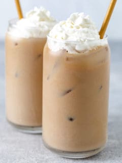 Two copycat iced coffee drinks with whipped topping.