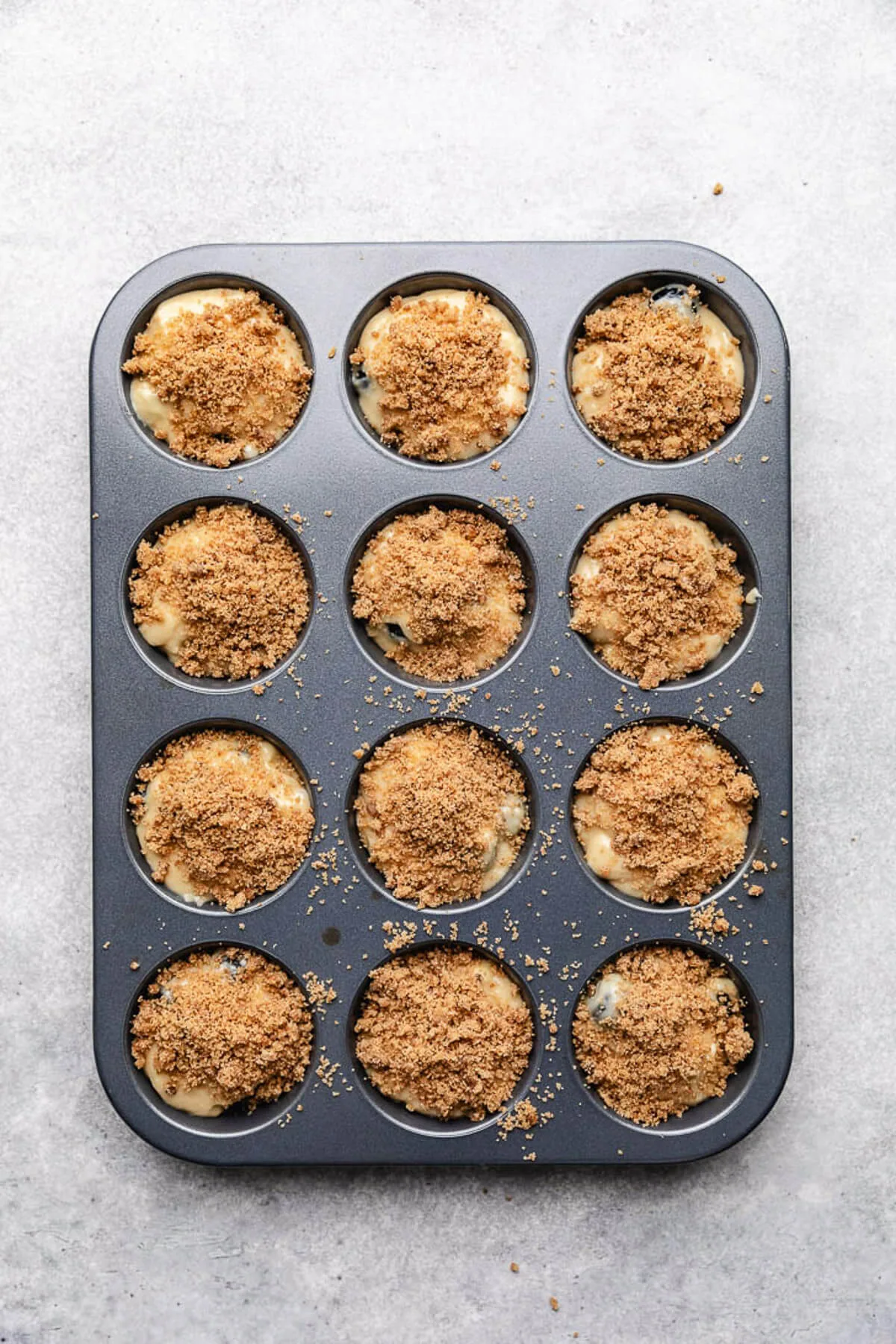 Blueberry Muffins Crumb topping added to unbaked muffin batter.