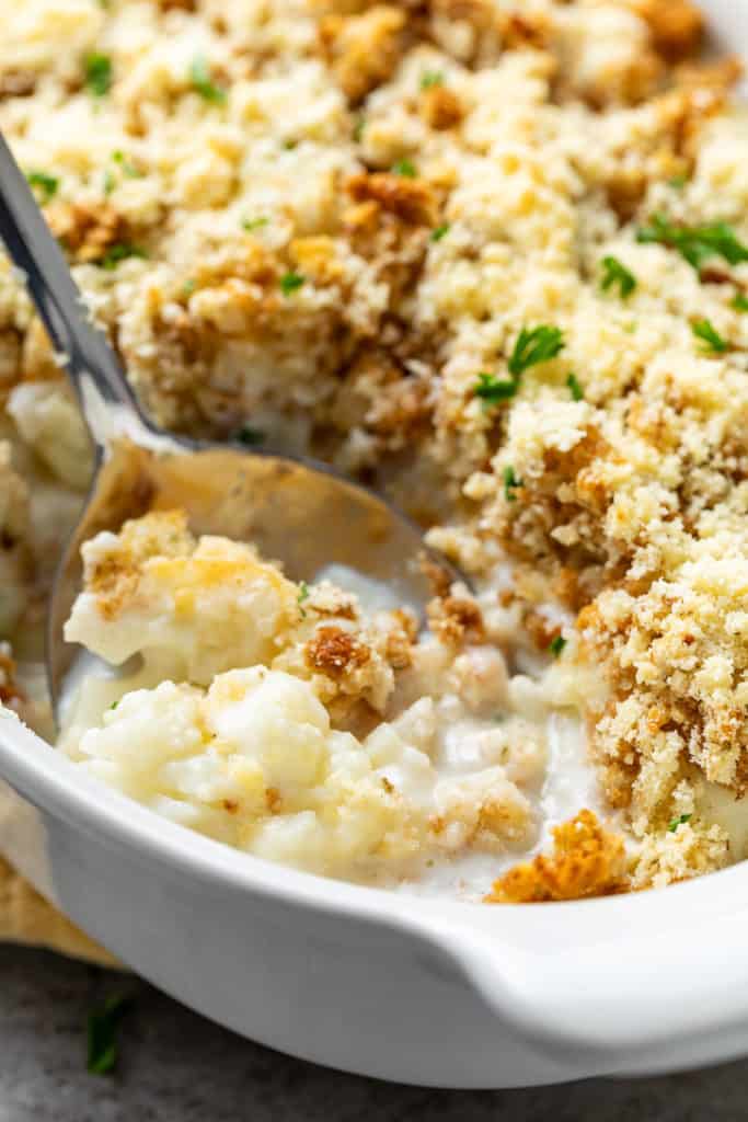 Close up view of casserole in a white baking dish.