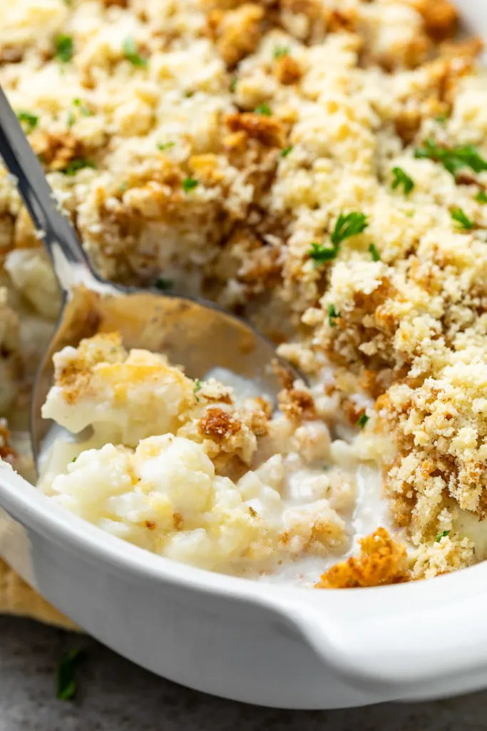 Close up view of casserole in a white baking dish.