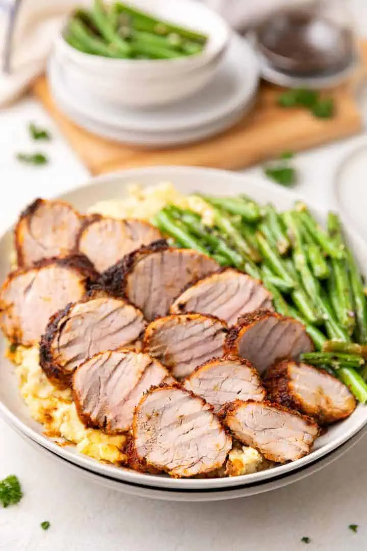 Sliced pork with asparagus.