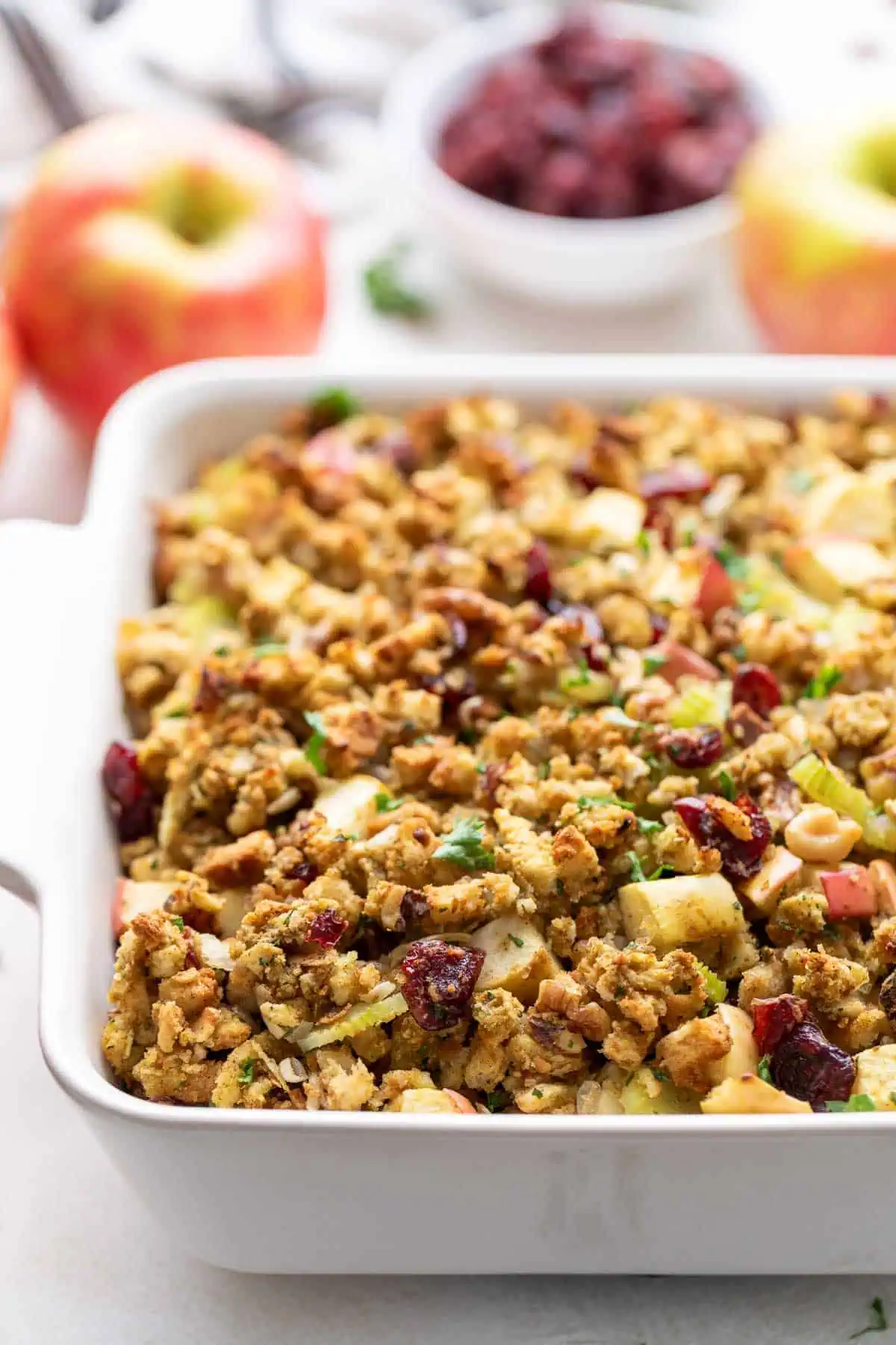 Close up view of a stuffing in a white baking pan.