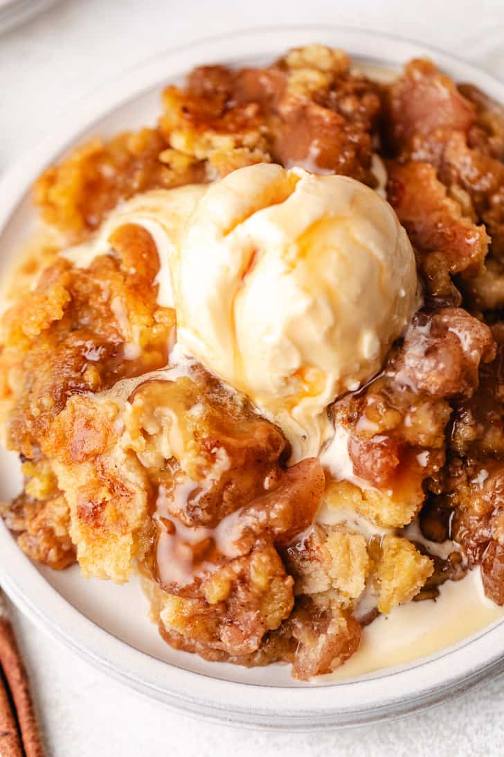 Top down view of a plate of dump cake with caramel.