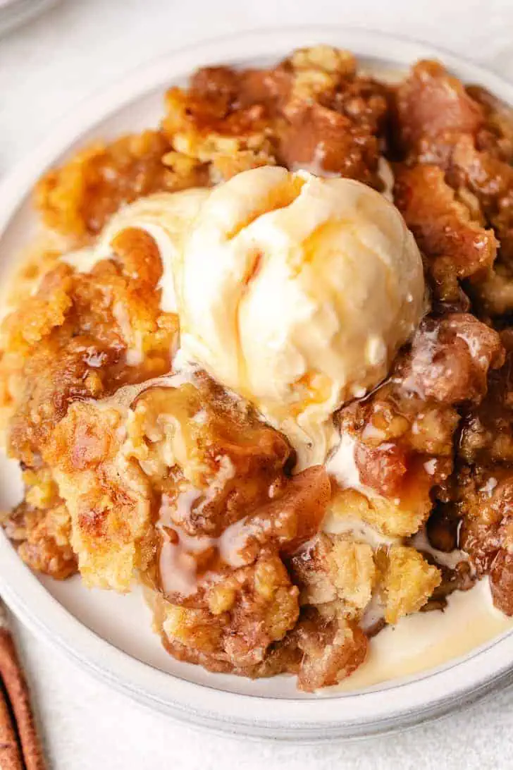 Top down view of a plate of dump cake with caramel.