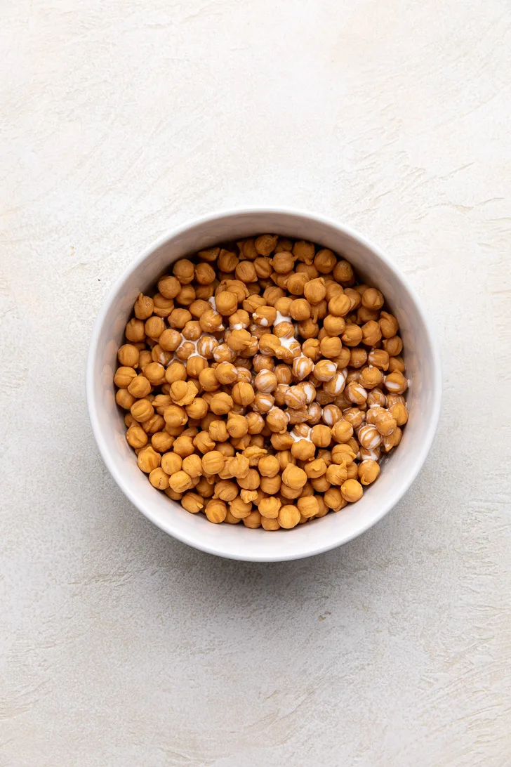 Caramel bits and heavy cream in a bowl.