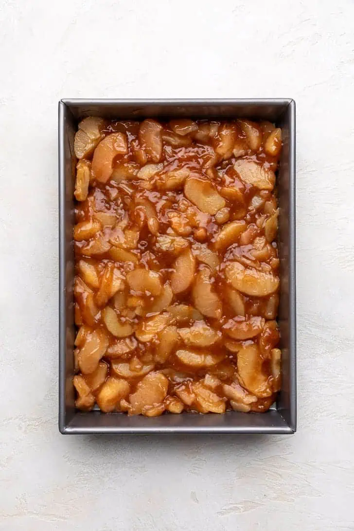 Spiced apple pie filling in a pan.