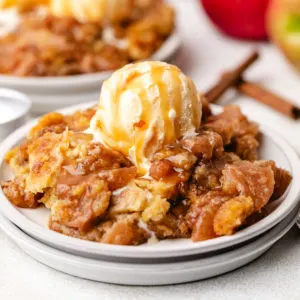 Vanilla ice cream and caramel sauce over apple dump cake.