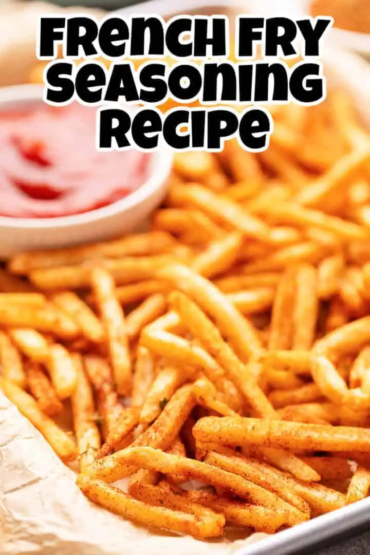 Close up view of seasoned french fries on a baking sheet.