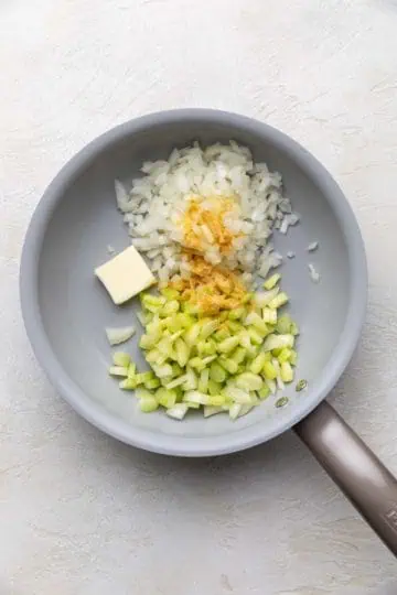 Butter, celery, onions, and seasonings in a skillet.