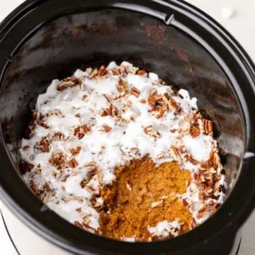 Scoop taken out of slow cooker sweet potato casserole.