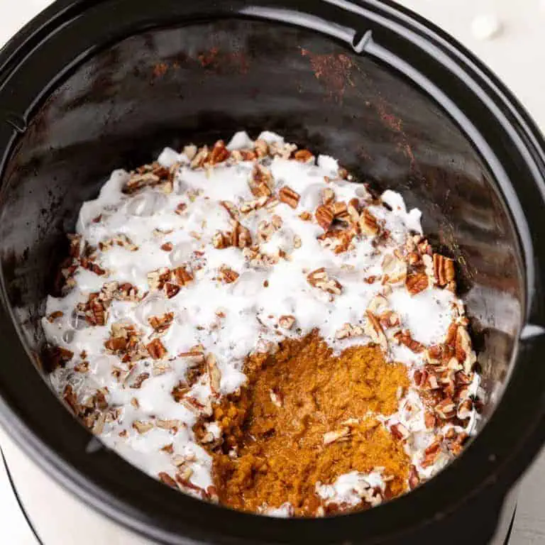 Scoop taken out of slow cooker sweet potato casserole.