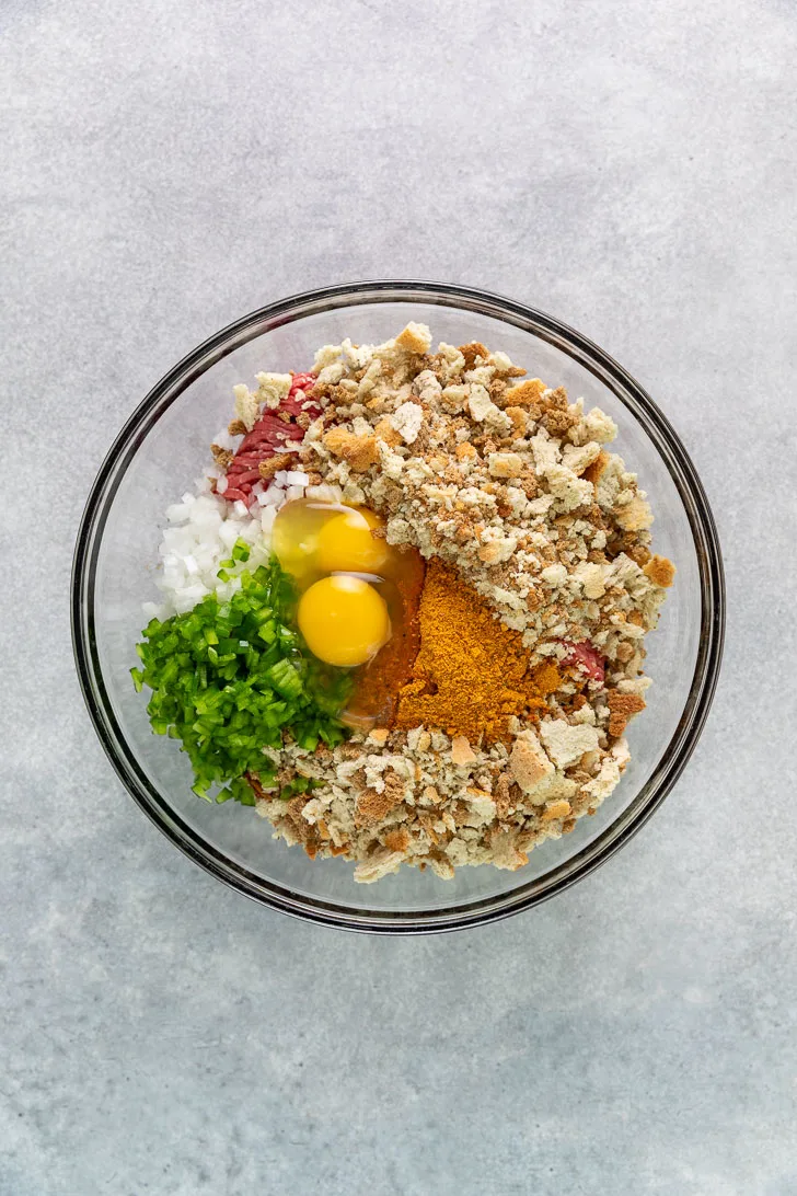 Ingredients for meatloaf in a bowl.