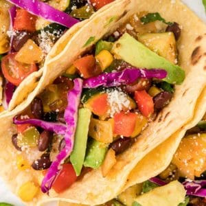 Top down view of vegetarian tacos on a plate.