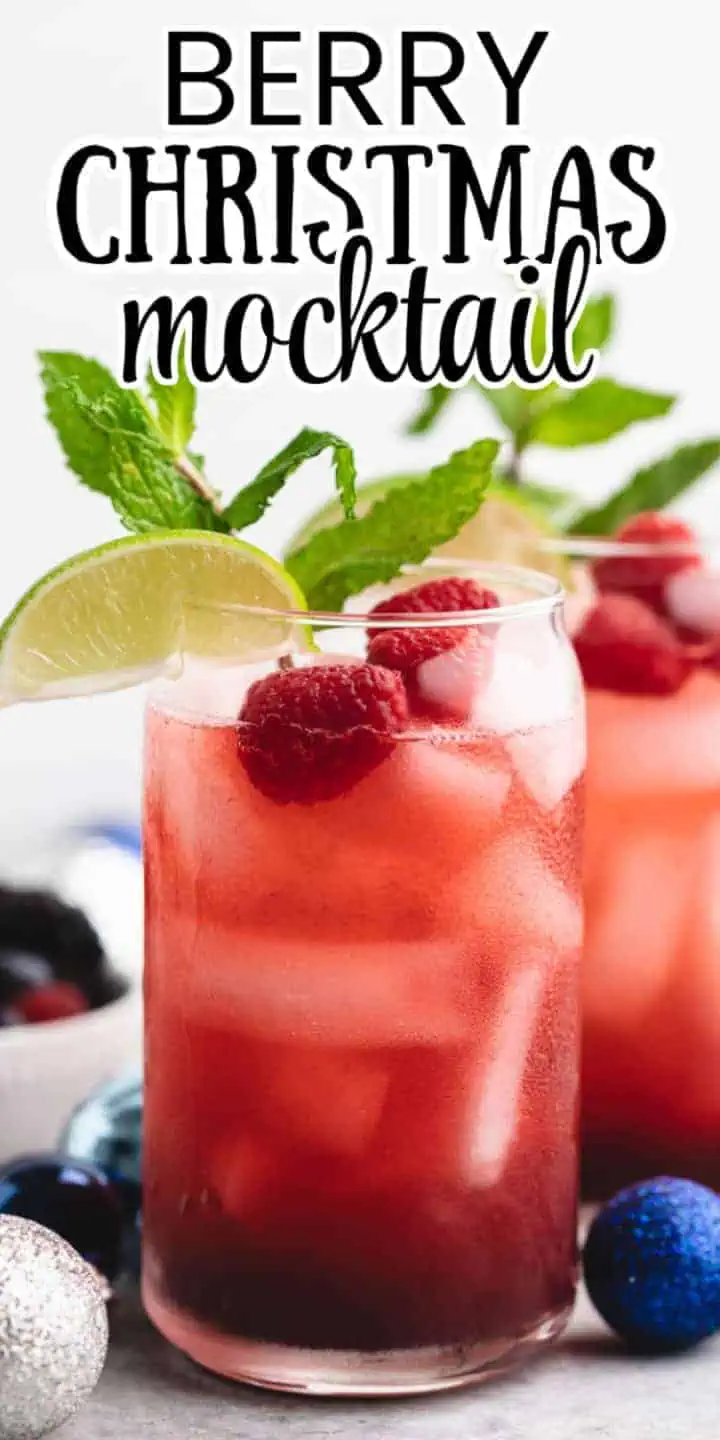 Side view of a berry ginger ale drink in a glass.