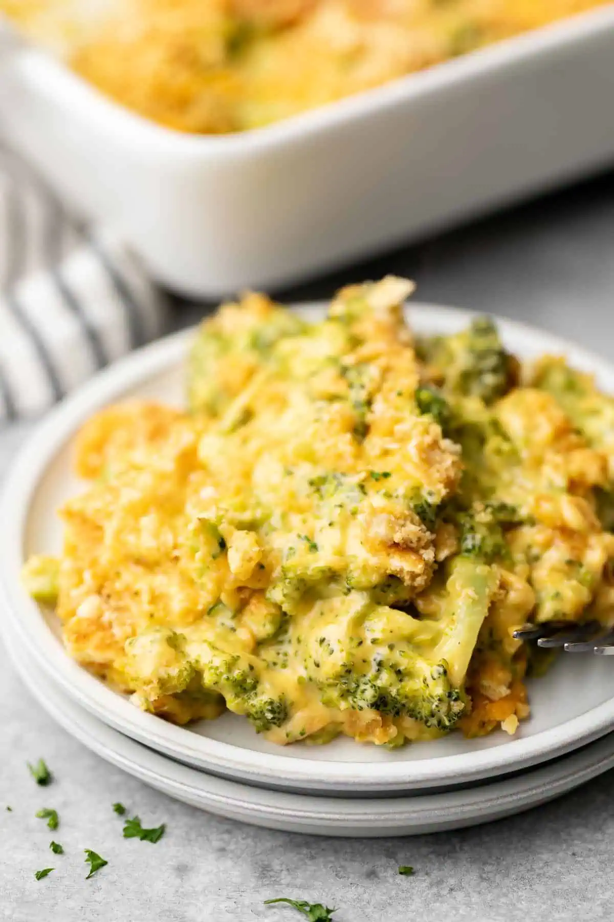 Side view of cheesy casserole on two plates.