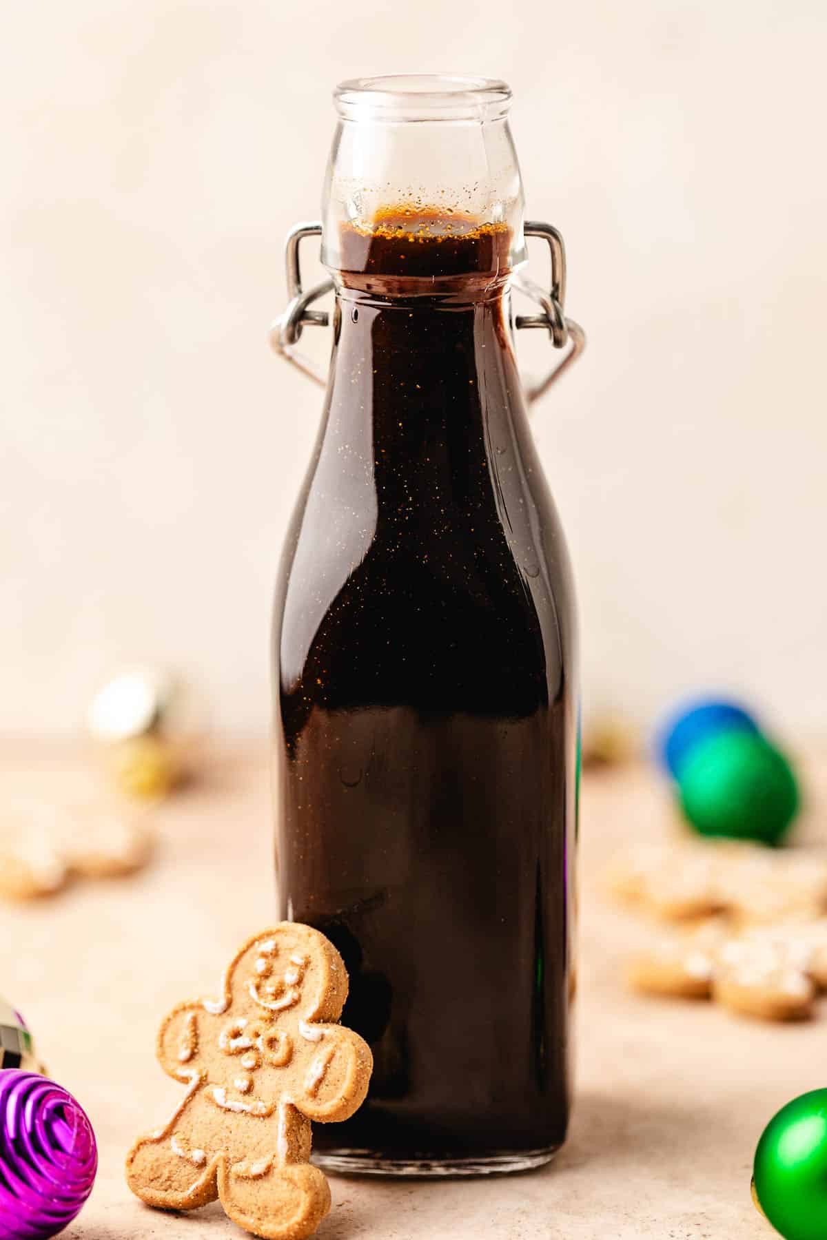 Tall jar filled with coffee syrup.