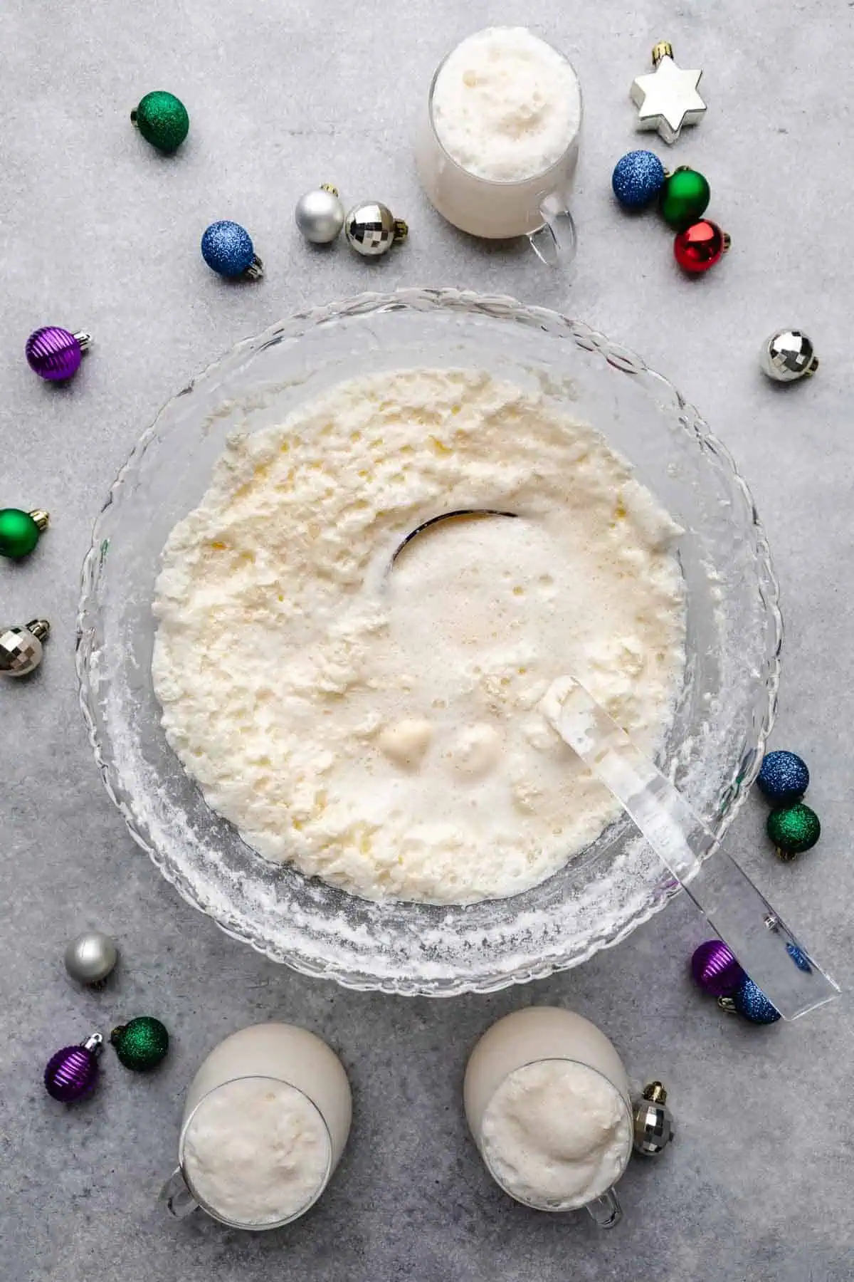 Top down view of white christmas punch in a serving bowl.