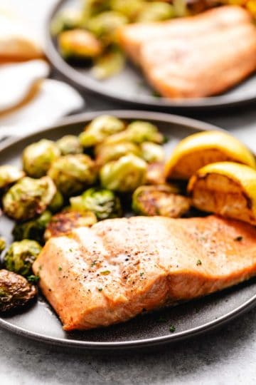 Air fryer salmon and brussels sprouts on a plate.