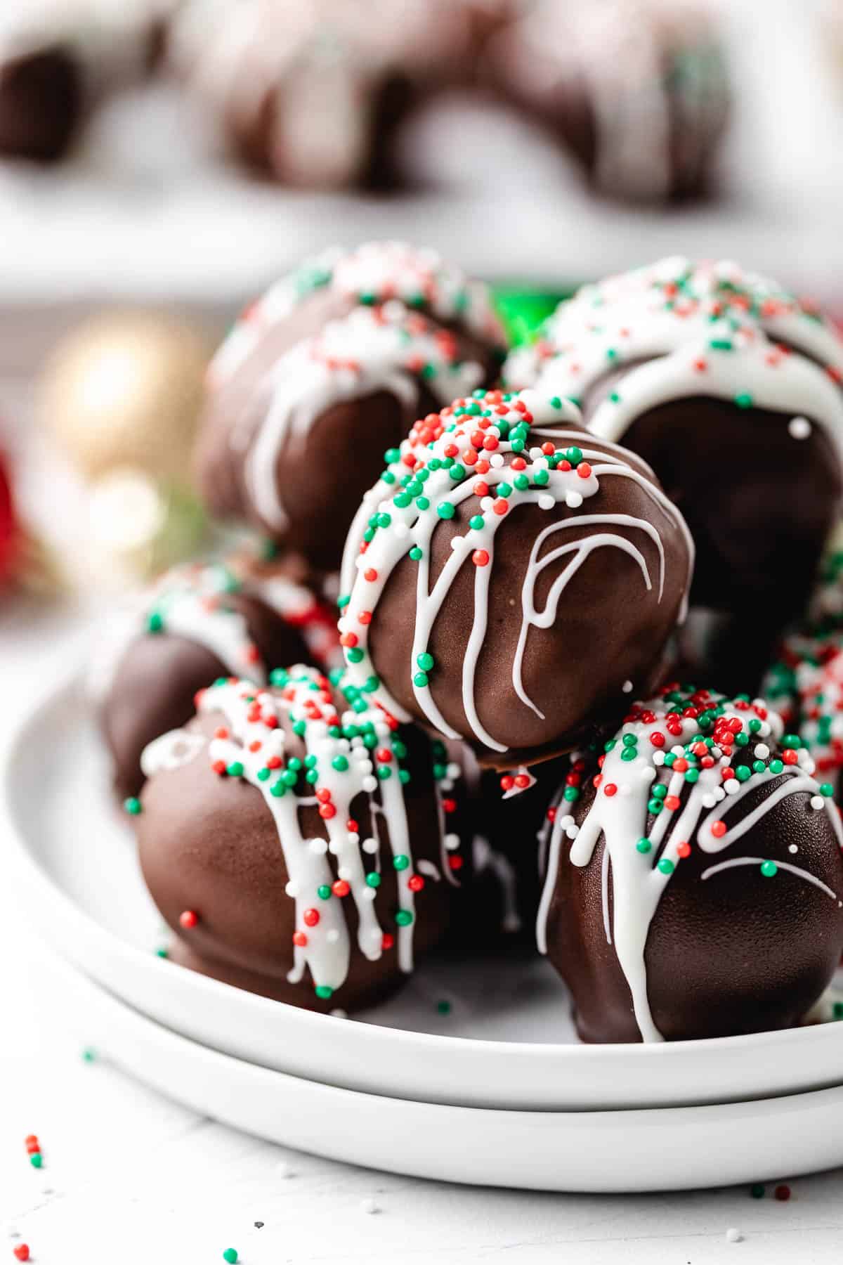 Red, green, and white sprinkles over brownie candies.