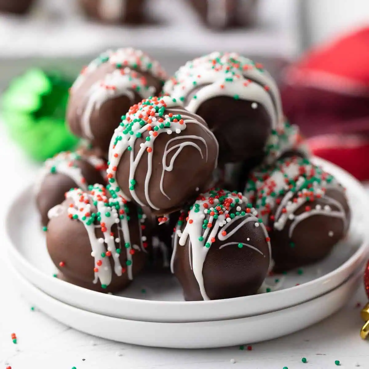 Brownie truffles piled on a plate.