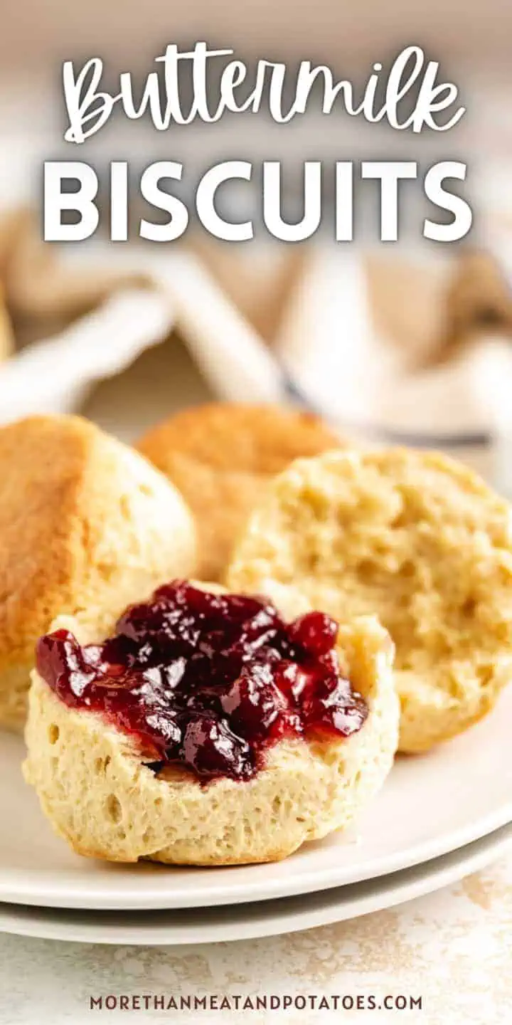 Close up view of jelly on a buttermilk biscuit.