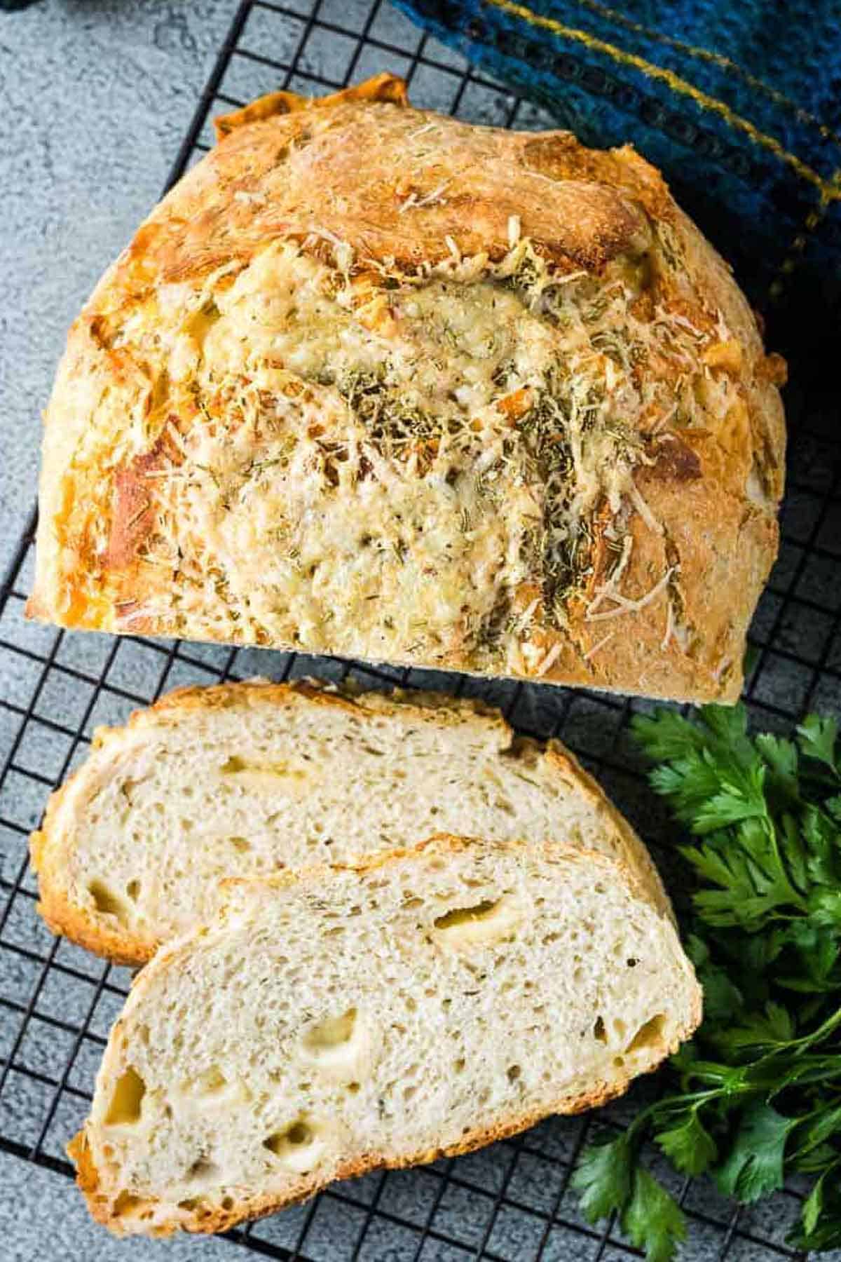 Roasted garlic asiago sourdough. Made in a Lodge Dutch oven and a