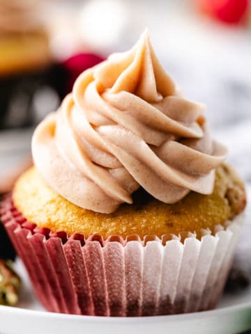 Close up view of a cupcake on a plate.