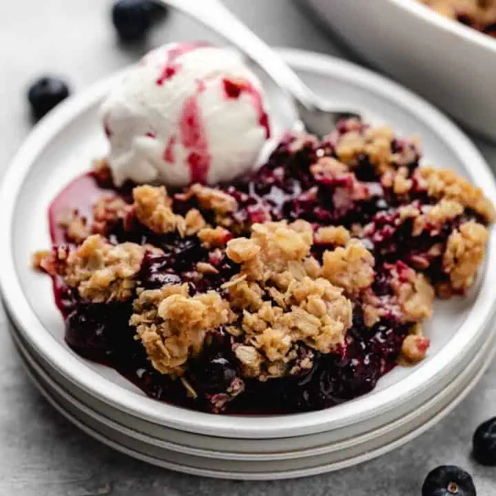 Fruit crumble on 3 plates.