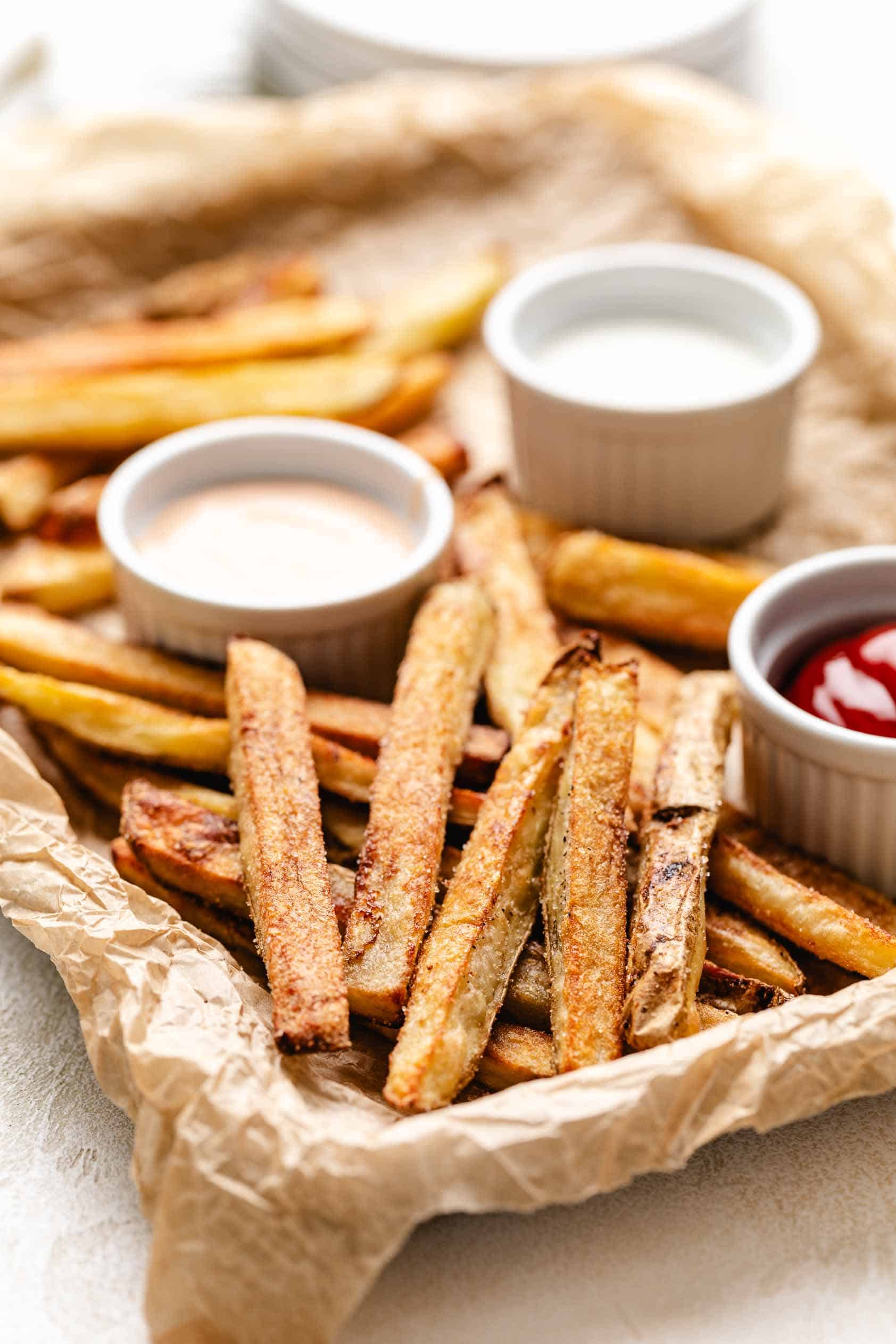 French fries on parchment paper.