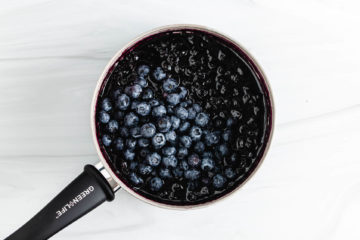 Fresh blueberries poured on top of blueberry compote.