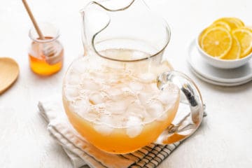 Honey simple syrup and lemon juice in a pitcher.