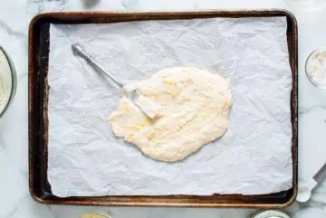 Cracker batter on a baking sheet.