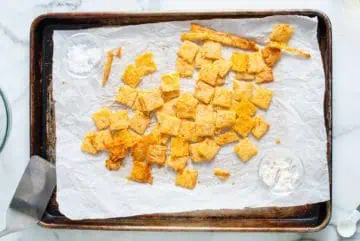 Salt and ranch seasoning added to cheese crackers.