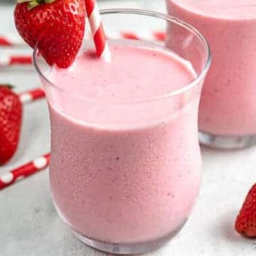 Close up view of a strawberry greek yogurt smoothie.