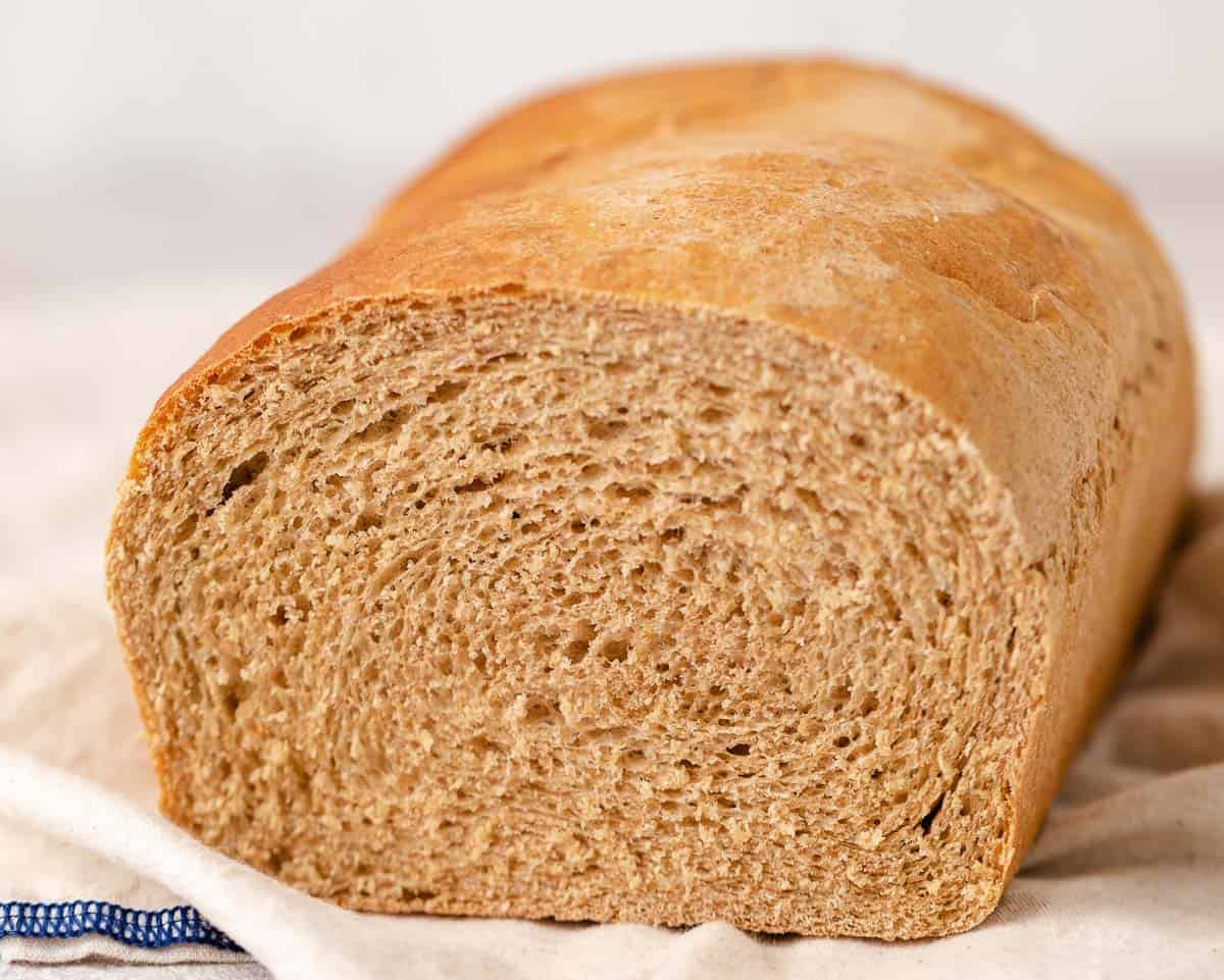 Side view of freshly baked honey wheat bread.