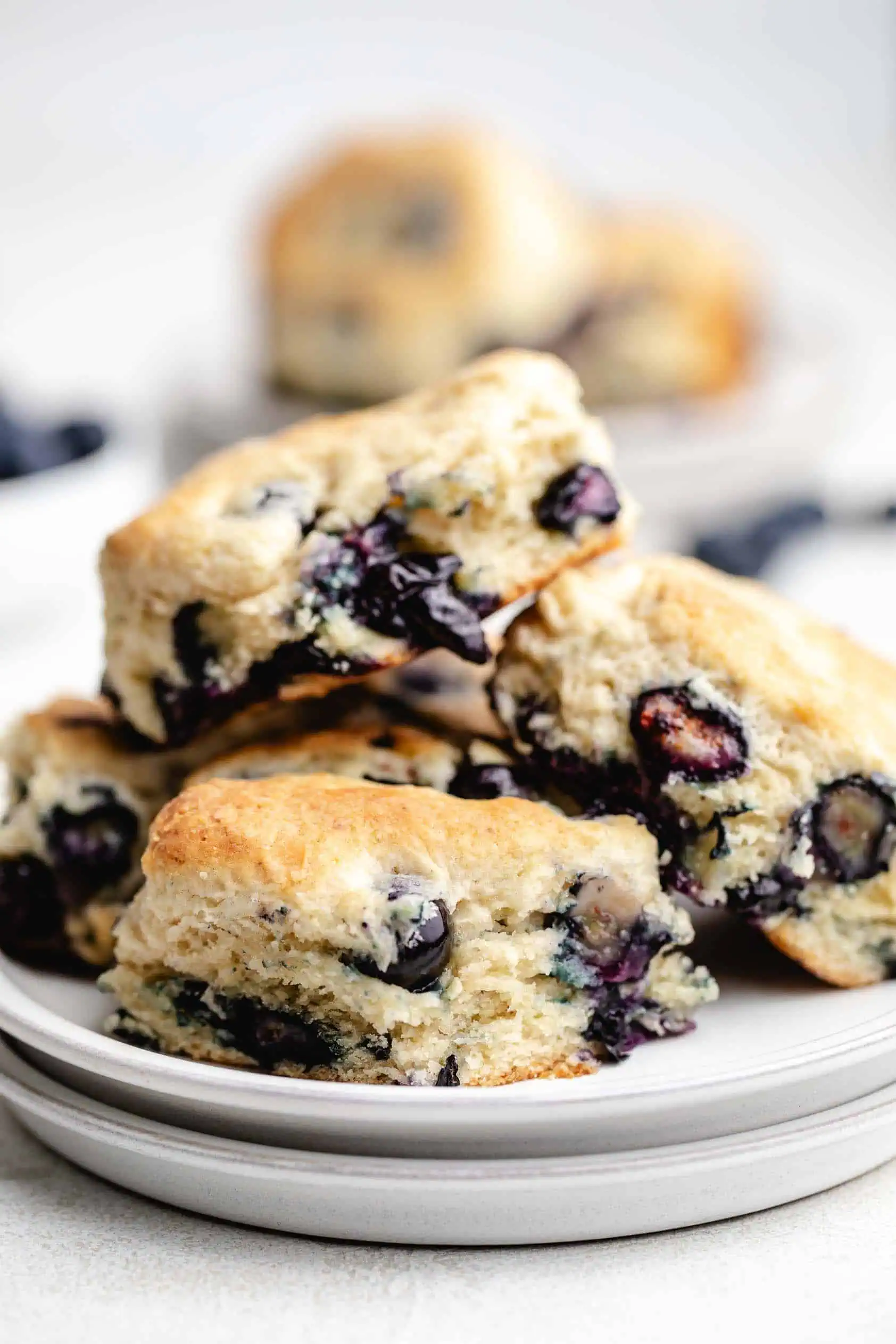 Plate piled with fruit filled biscuits.