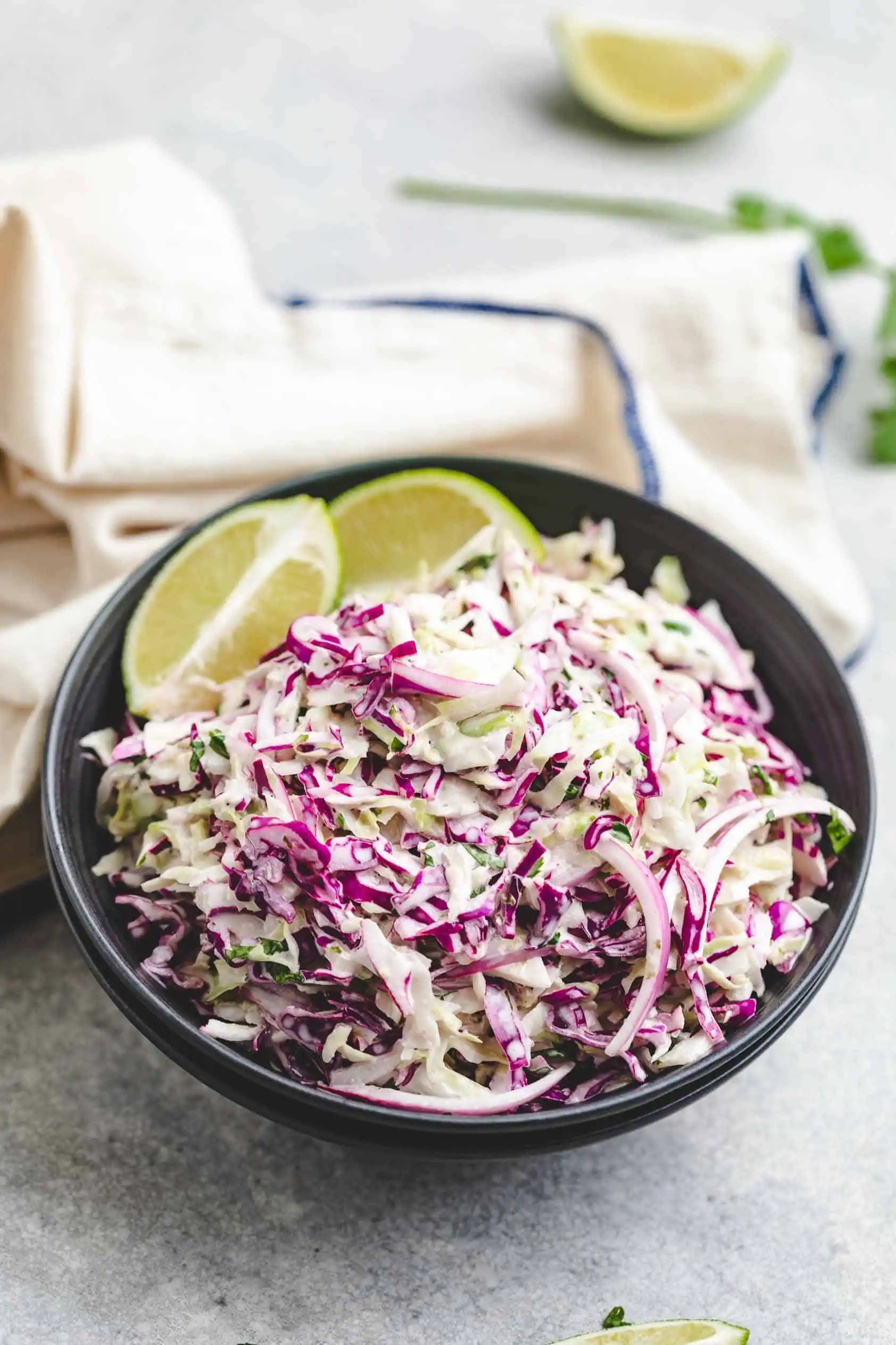 Dark bowl filled with slaw.