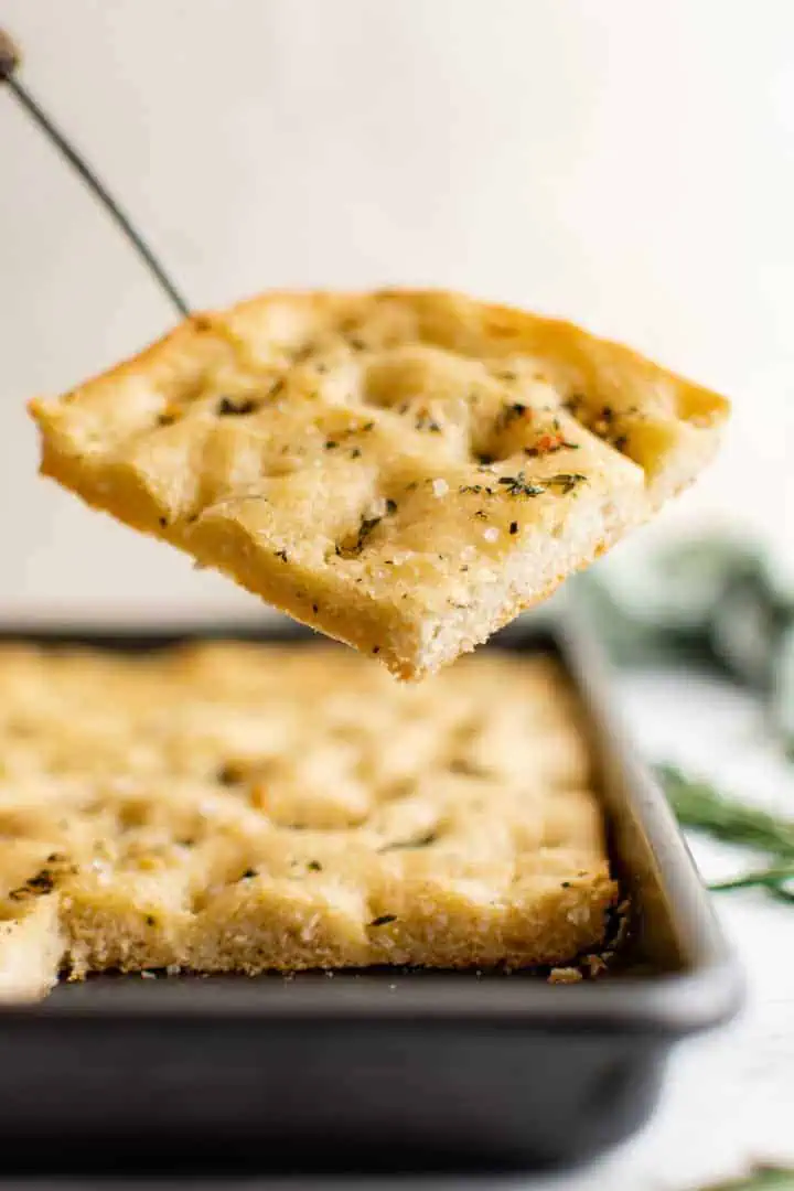 Slice of focaccia on a spatula.