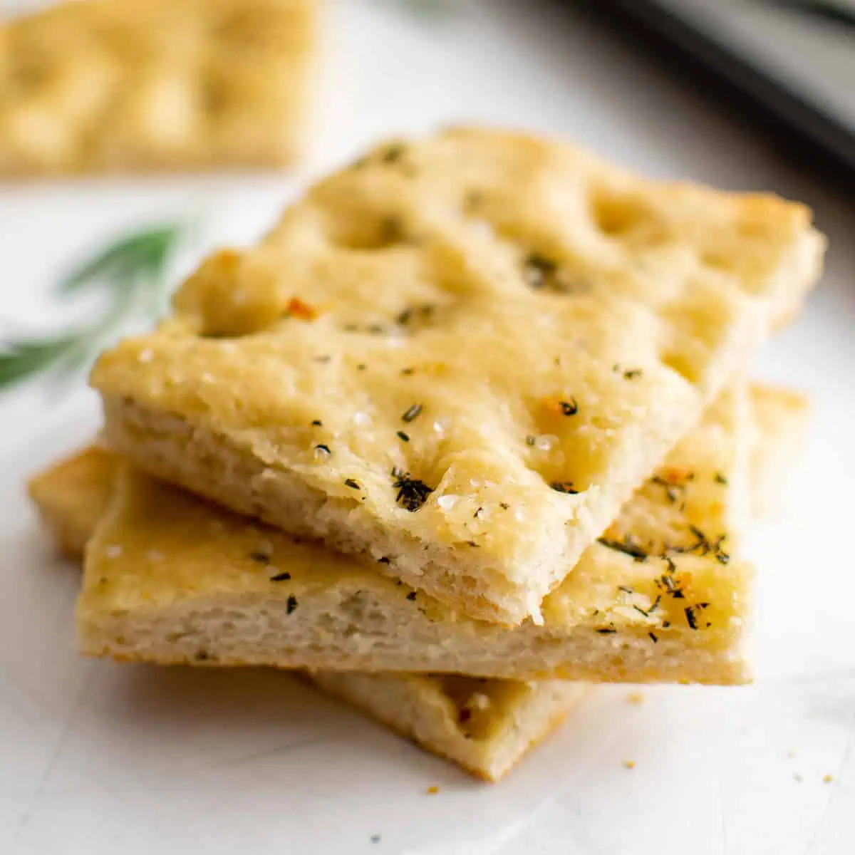 Slices of focaccia bread in a stack.