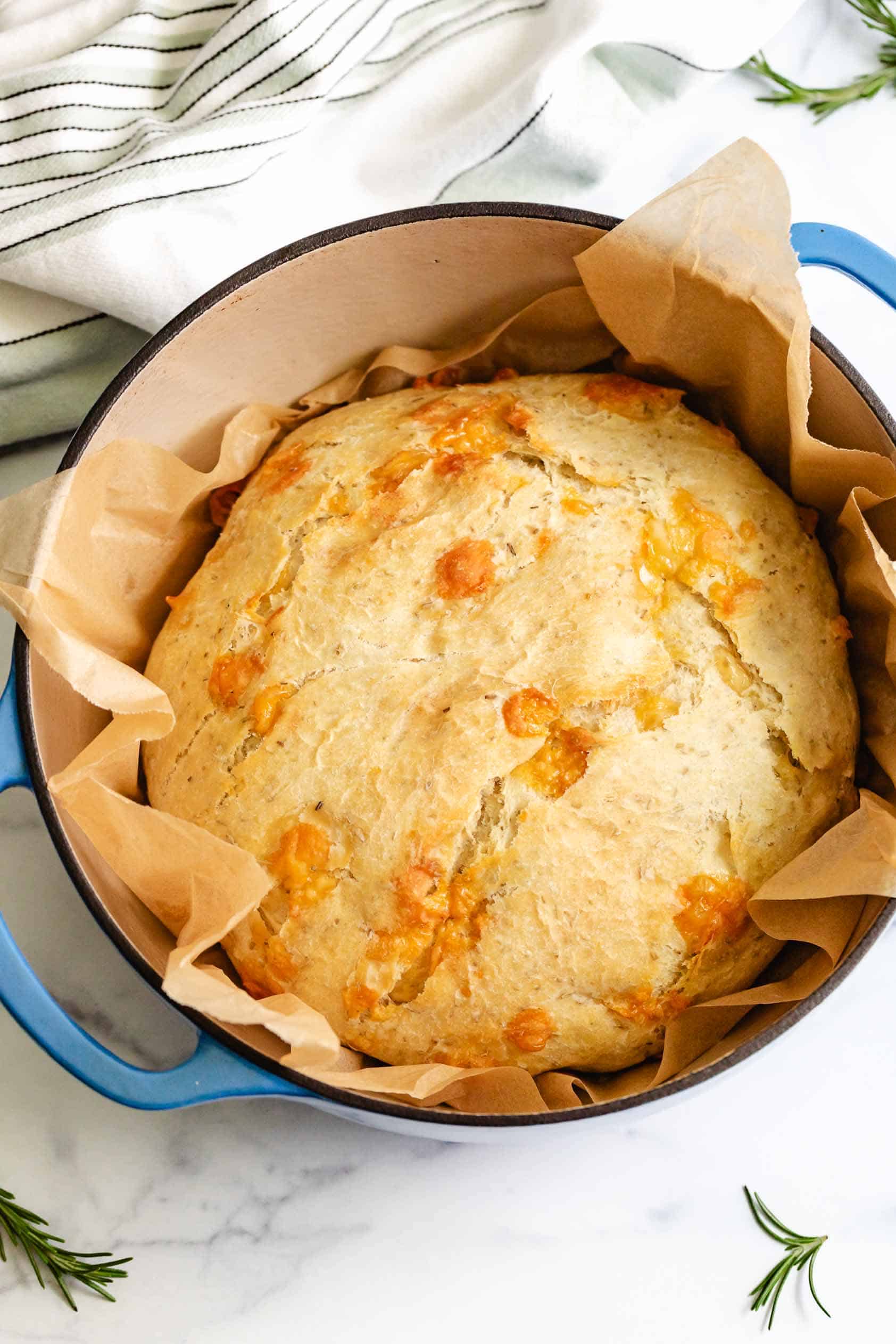 Cheesy bread in a blue dutch oven.