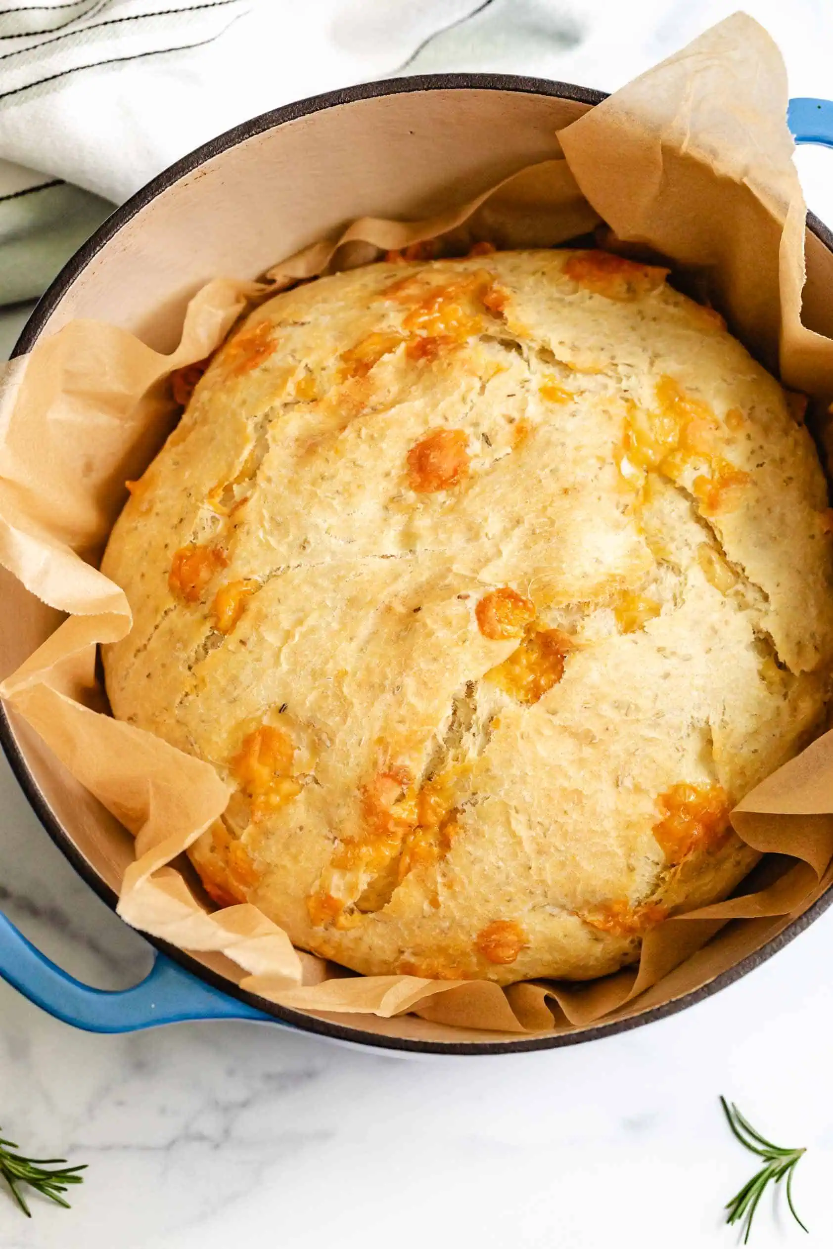 Loaf of rustic bread in a pan.