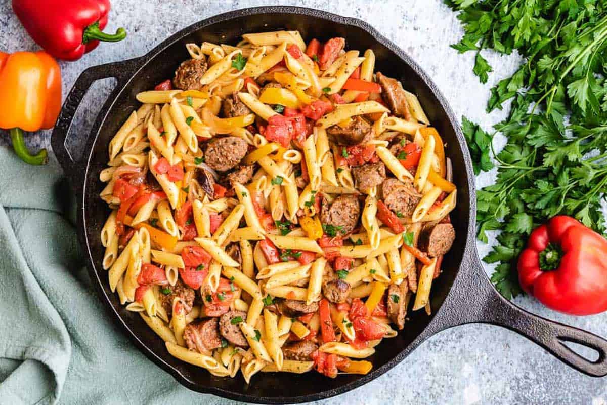 Sausage and peppers pasta in cast iron.