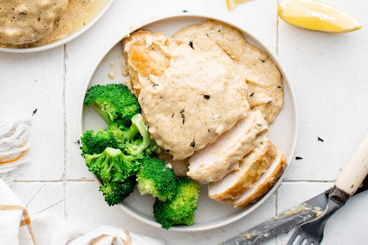 Lemon chicken and broccoli on a plate.